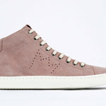 Side profile of mid top sneaker in pink suede and leather upper, internal zip and white sole.