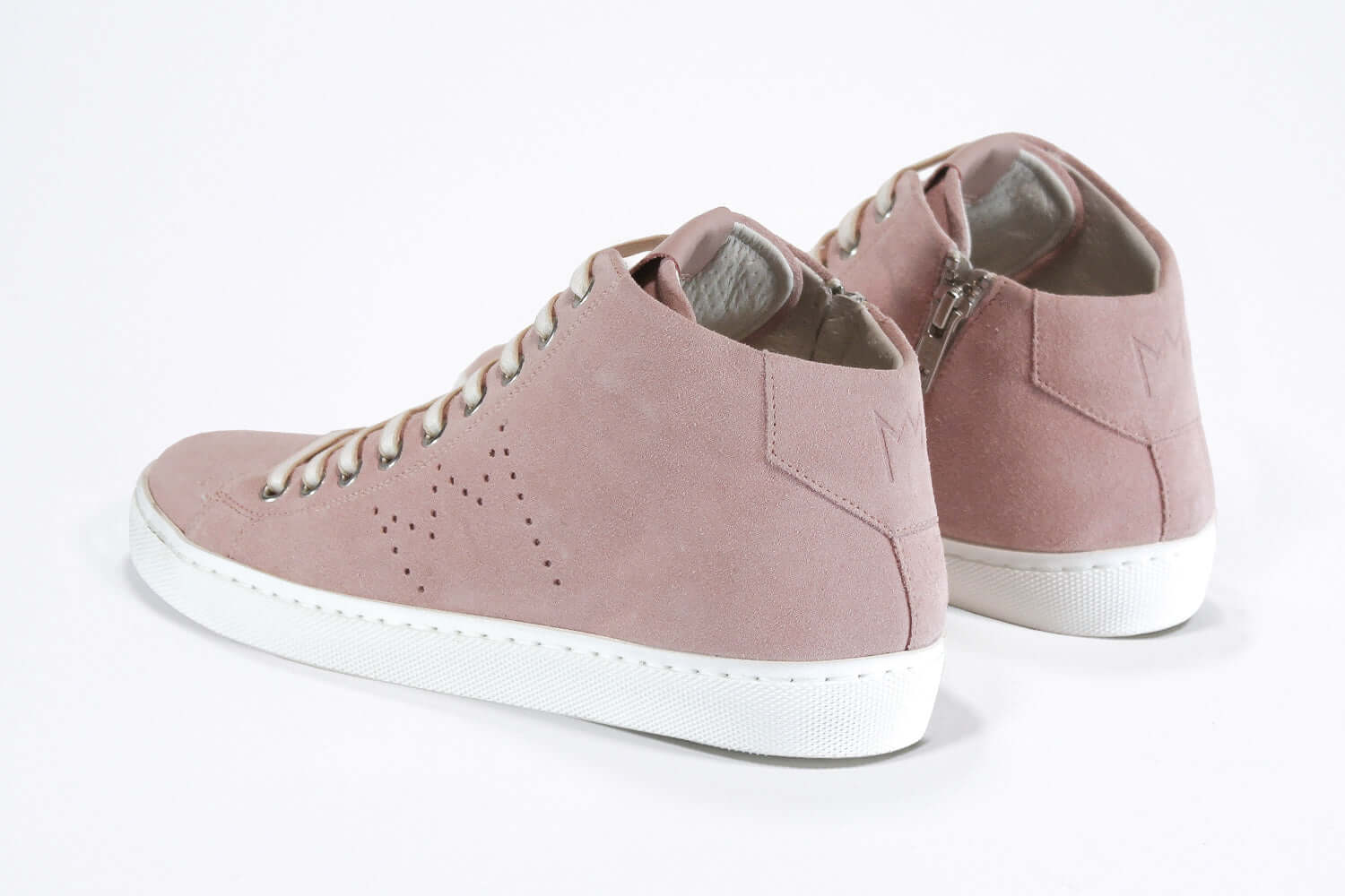 Three quarter back view of mid top sneaker in pink suede and leather upper, internal zip and white sole.