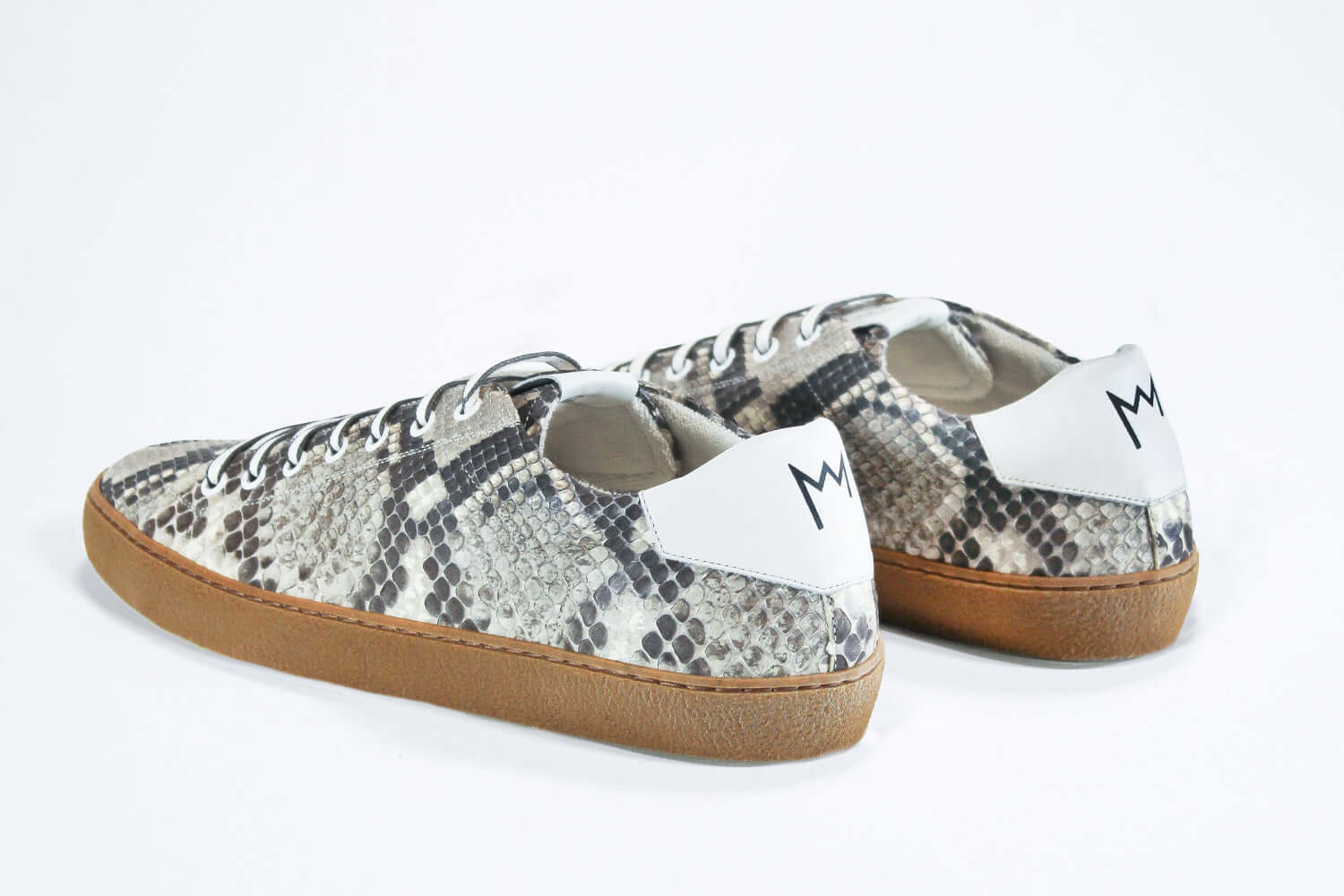 Back view of low top python skin sneaker. Full snake skin upper and honey coloured rubber sole.