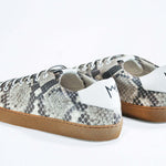 Back view of low top python skin sneaker. Full snake skin upper and honey coloured rubber sole.