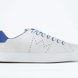 Side profile of low top white sneaker with blue detailing and perforated crown logo on upper. Full leather upper and white rubber sole.