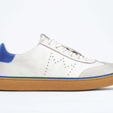 Side view of low top retro sneaker in distressed white leather with blue detailing and honey coloured recycled rubber sole.