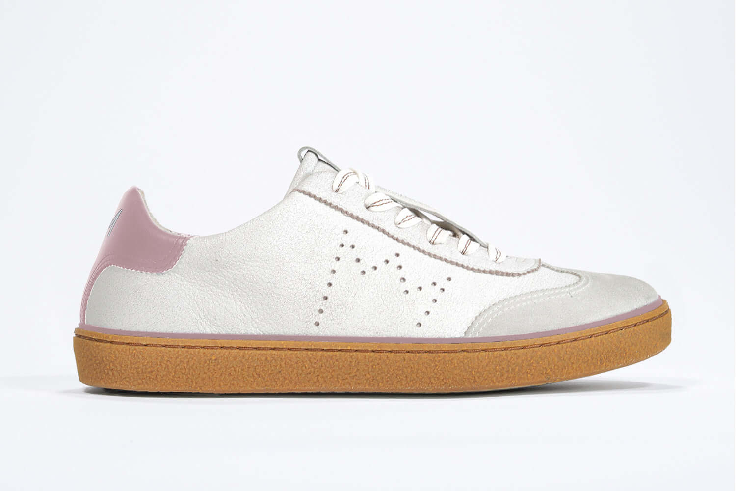 Side view of low top retro sneaker in distressed white leather with peach detailing and honey coloured recycled rubber sole.