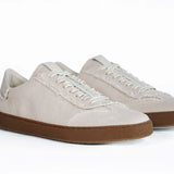 Three quarter front view of low top retro sneaker in distressed stone canvas, with honey coloured recycled rubber sole.
