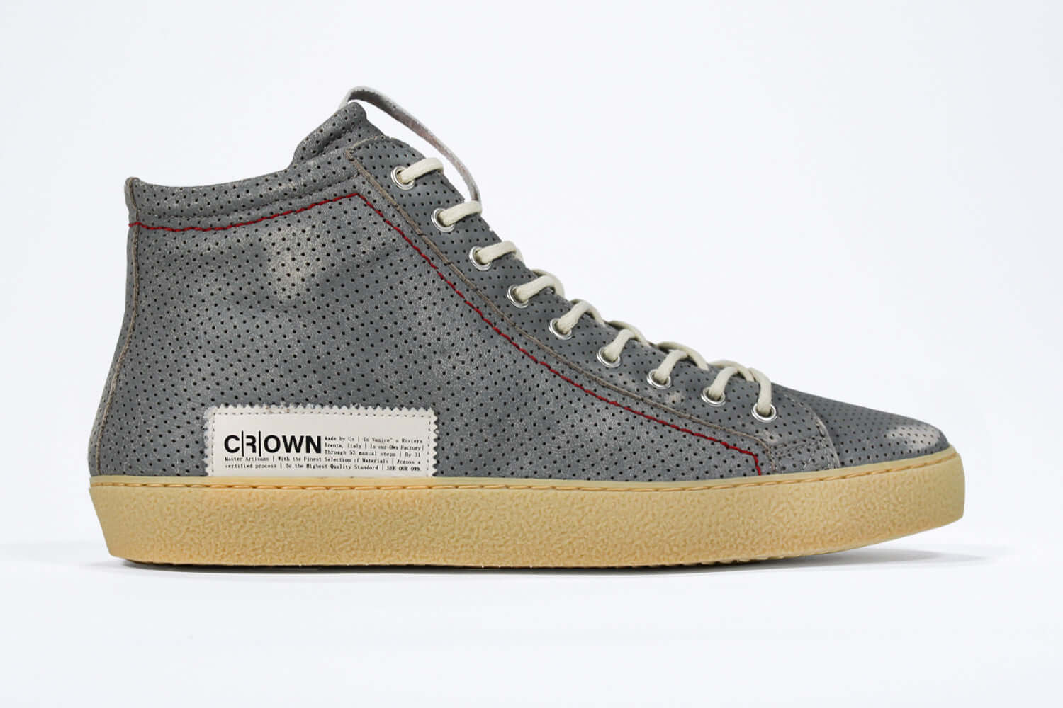Side profile of high top perforated aged grey leather sneaker with signature red stitching and a dark natural rubber sole.