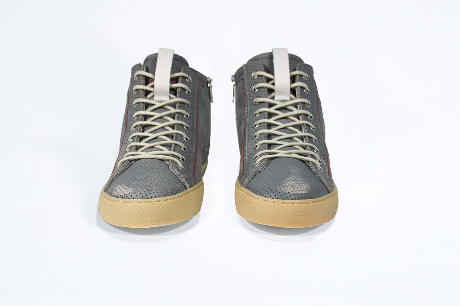Front view of high top perforated aged grey leather sneaker with signature red stitching and a dark natural rubber sole.