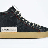 Side profile of high top perforated aged navy leather sneaker with signature red stitching and a pale natural rubber sole.