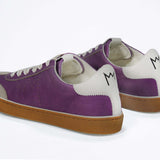 Back view of low top retro sneaker in distressed violet leather with white and grey detailing and honey coloured recycled rubber sole.