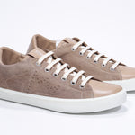 Three quarter front view of low top camel sneaker with perforated crown logo on upper. Full suede upper and white rubber sole.