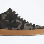Side profile of mid top camouflage print sneaker in canvas, internal zip and honey coloured sole.