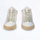 Front view of high top canvas sneaker. White canvas upper with signature red stitching and pale natural rubber sole.