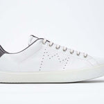 Side profile of low top white sneaker with dark grey detailing and perforated crown logo on upper. Full leather upper and white rubber sole.