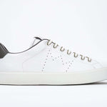 Side profile of low top white sneaker with military green detailing and perforated crown logo on upper. Full leather upper and white rubber sole.