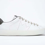 Side profile of low top white sneaker with military green detailing and perforated crown logo on upper. Full leather upper and white rubber sole.