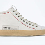 Side profile of high top canvas sneaker. Canvas white upper with signature red stitching and a pale natural rubber sole.