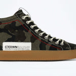 Side view of high top canvas sneaker. Camouflage canvas upper with signature red stitching and a dark natural rubber sole.