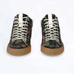 Front view of high top canvas sneaker. Camouflage canvas upper with signature red stitching and a dark natural rubber sole.