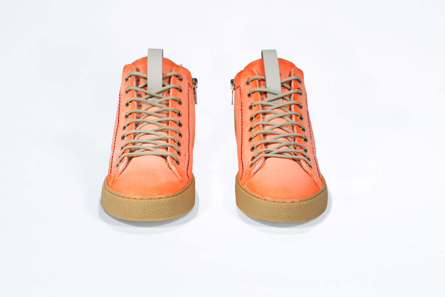 Front view of high top canvas sneaker. Canvas upper hand painted in gradated fluo orange paint. Pale natural rubber sole.