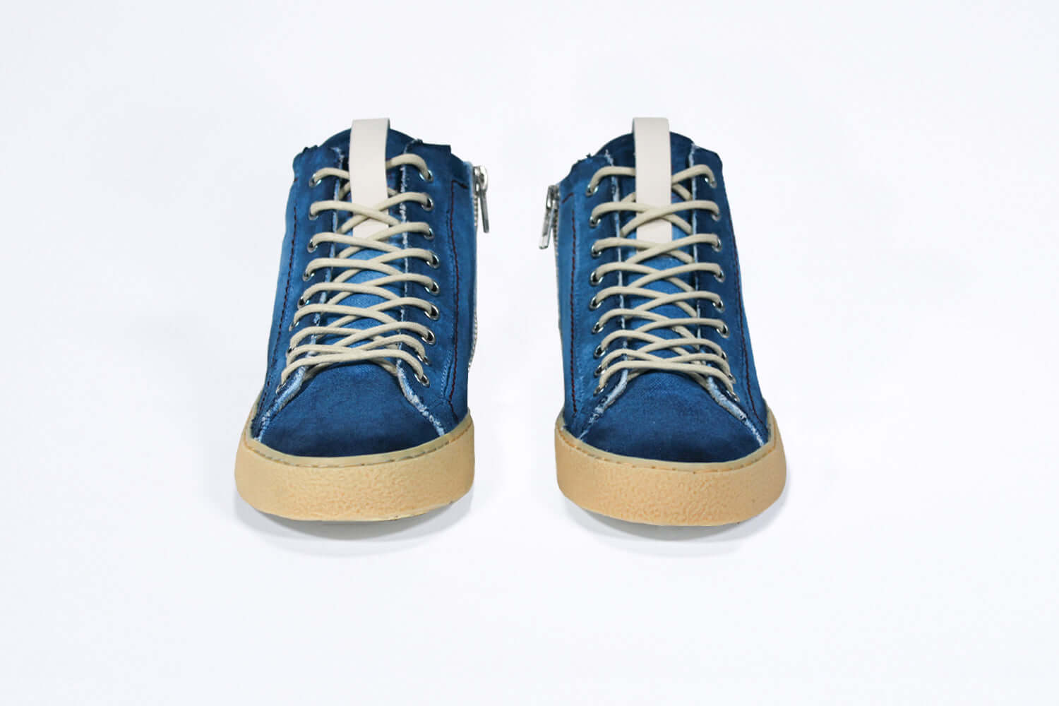 Front view of high top canvas sneaker. Canvas upper hand painted in gradated blue paint. Pale natural rubber sole.