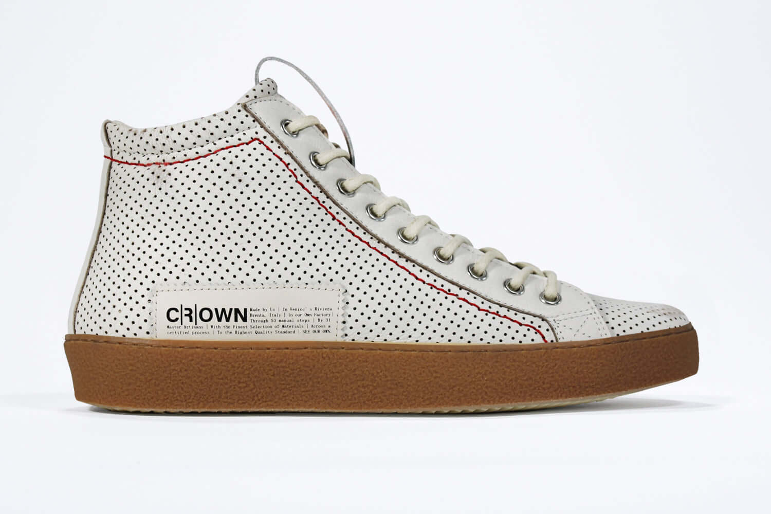Side profile of high top perforated aged white leather sneaker with signature red stitching and a dark natural rubber sole.