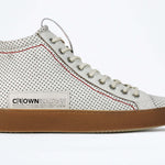 Side profile of high top perforated aged white leather sneaker with signature red stitching and a dark natural rubber sole.