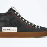 Side profile of high top perforated aged black leather sneaker with signature red stitching and a dark natural rubber sole.