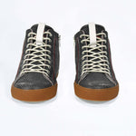 Front view of high top perforated aged black leather sneaker with signature red stitching and a dark natural rubber sole.