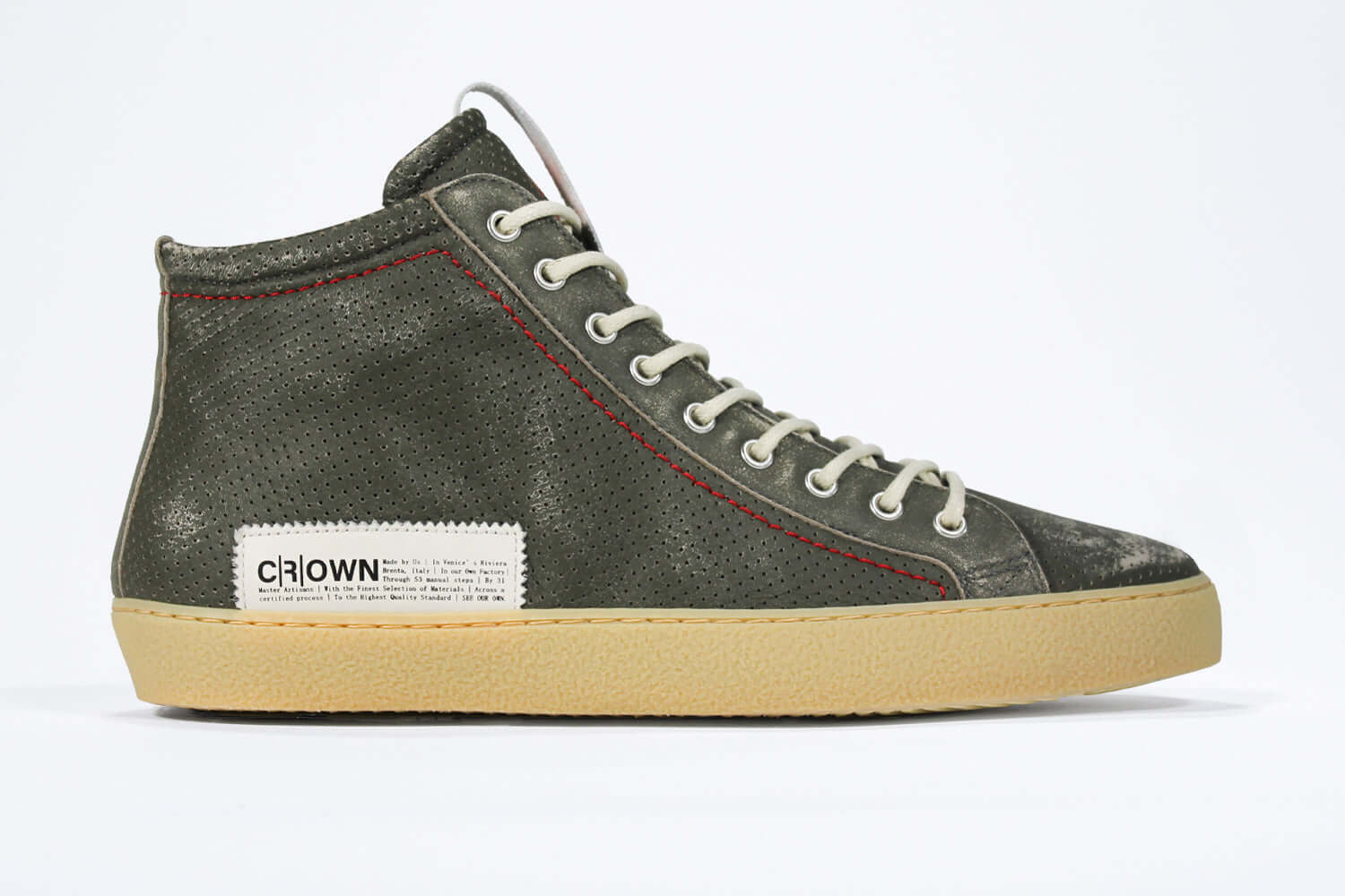 Side profile of high top perforated aged khaki leather sneaker with signature red stitching and a pale natural rubber sole.