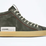 Side profile of high top perforated aged khaki leather sneaker with signature red stitching and a pale natural rubber sole.
