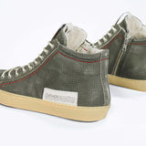 Back view of high top perforated aged khaki leather sneaker with signature red stitching and a pale natural rubber sole.