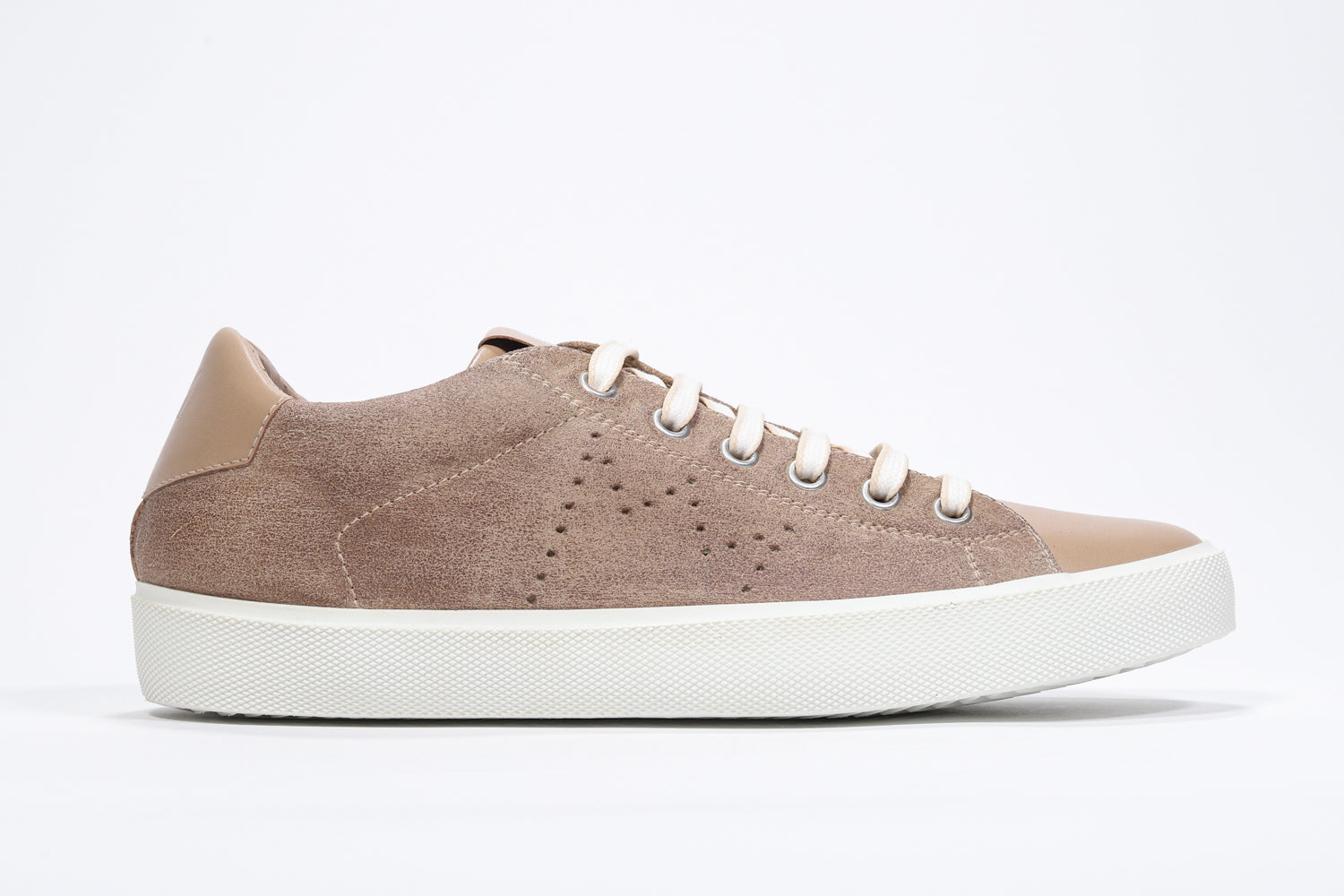 Side profile of low top camel sneaker with perforated crown logo on upper. Full suede upper and white rubber sole.