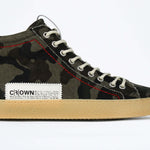 Side profile of high top canvas sneaker. Camouflage print canvas upper with signature red stitching and pale natural rubber sole.