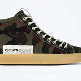 Side profile of high top canvas sneaker. Camouflage print canvas upper with signature red stitching and pale natural rubber sole.