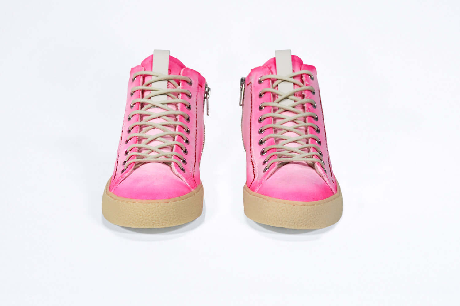Front view of high top canvas sneaker. Canvas upper hand painted in gradated fluo pink paint. Pale natural rubber sole.