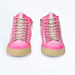 Front view of high top canvas sneaker. Canvas upper hand painted in gradated fluo pink paint. Pale natural rubber sole.
