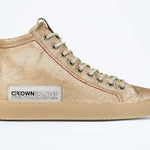 Side profile of high top canvas sneaker. Canvas upper hand painted in gradated gold paint. Natural rubber sole.