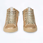 Front view of high top canvas sneaker. Canvas upper hand painted in gradated gold paint. Natural rubber sole.
