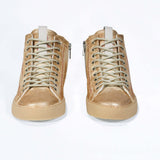 Front view of high top canvas sneaker. Canvas upper hand painted in gradated gold paint. Natural rubber sole.