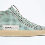 Side profile of high top sneaker. Perforated sky blue leather sneakers with signature red stitching and pale natural rubber sole.