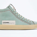 Side profile of high top sneaker. Perforated sky blue leather sneakers with signature red stitching and pale natural rubber sole.