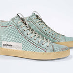 Three quarter front view of high top sneaker. Perforated sky blue leather sneakers with signature red stitching and pale natural rubber sole.