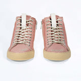 Front view of high top sneaker. Perforated pink leather sneakers with signature red stitching and pale natural rubber sole.