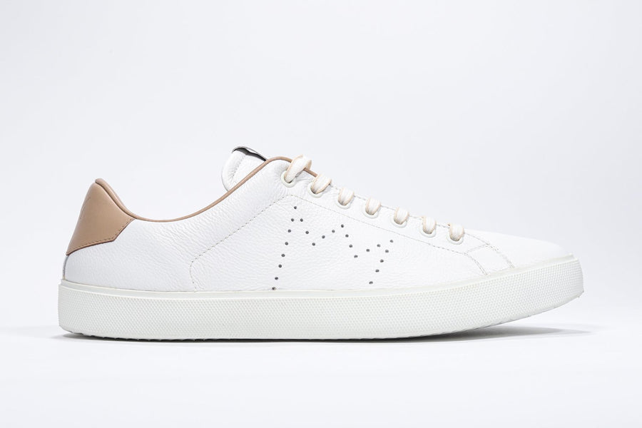 Side profile of low top white sneaker with cuoio detailing and perforated crown logo on upper. Full leather upper and white rubber sole.