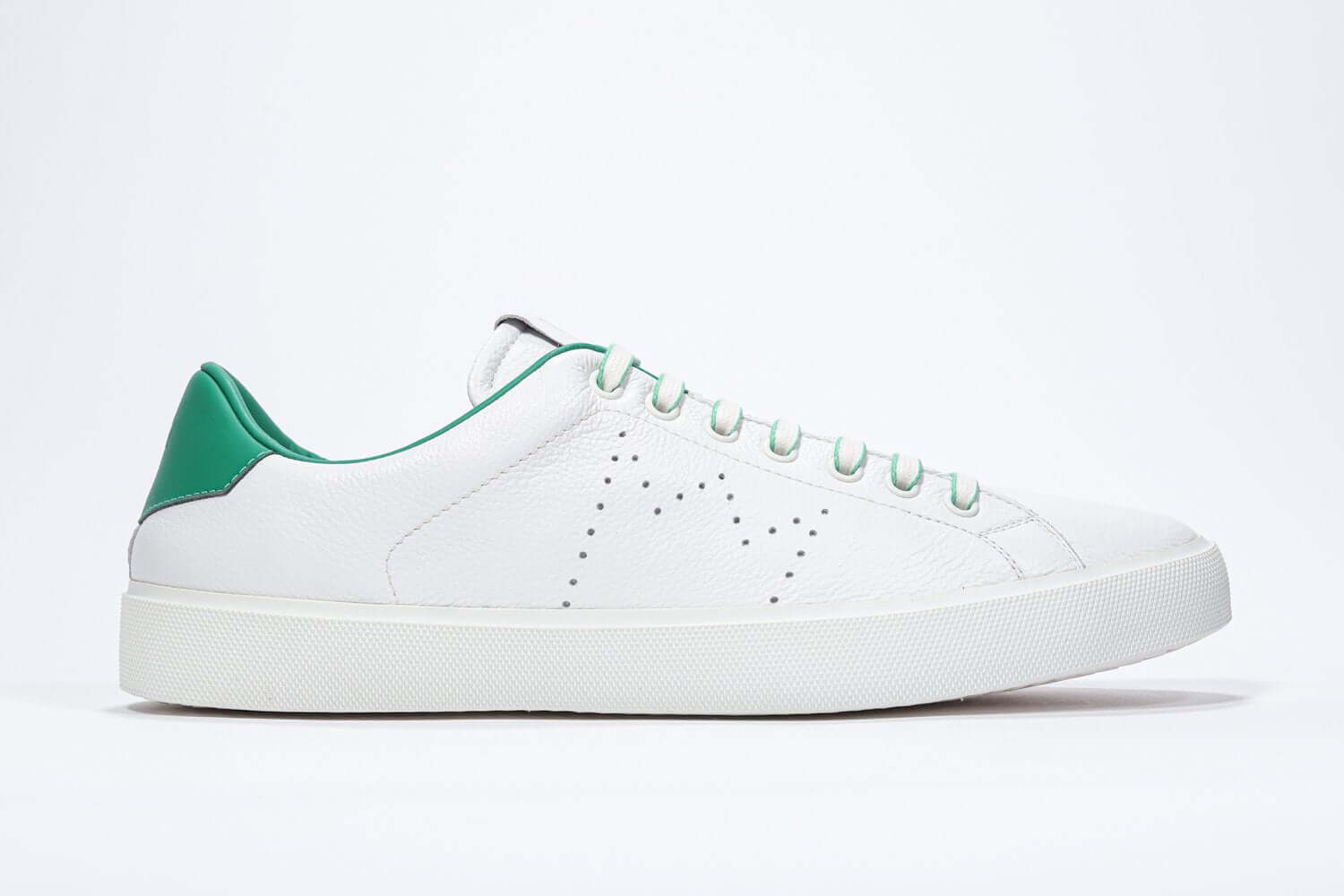 Side profile of low top white sneaker with green detailing and perforated crown logo on upper. Full leather upper and white rubber sole.