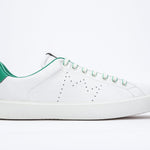 Side profile of low top white sneaker with green detailing and perforated crown logo on upper. Full leather upper and white rubber sole.