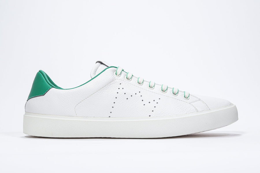 Side profile of low top white sneaker with green detailing and perforated crown logo on upper. Full leather upper and white rubber sole.