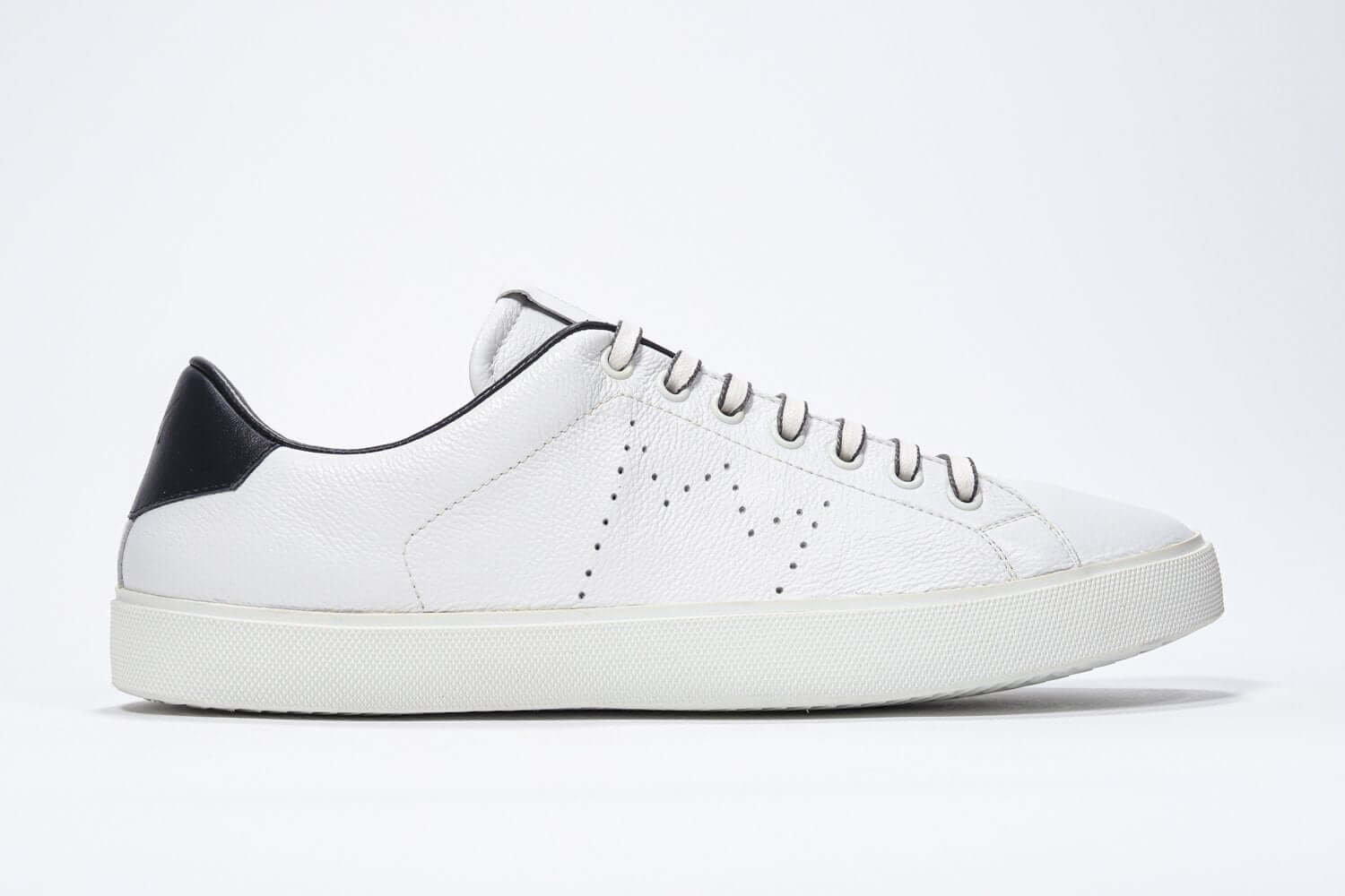 Side profile of low top white sneaker with navy detailing and perforated crown logo on upper. Full leather upper and white rubber sole.