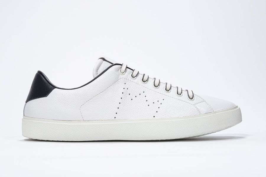 Side profile of low top white sneaker with navy detailing and perforated crown logo on upper. Full leather upper and white rubber sole.