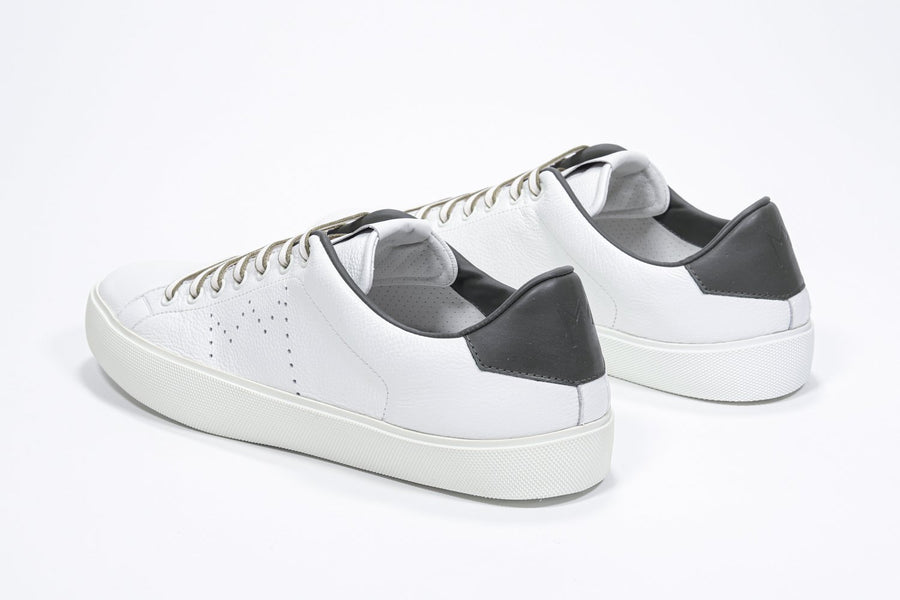 Three quarter back view of low top white sneaker with military green detailing and perforated crown logo on upper. Full leather upper and white rubber sole.