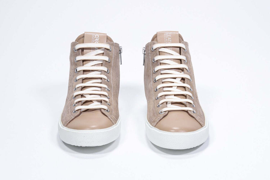 Front view of mid top cuoio sneaker with full suede upper with perforated crown logo, internal zip and white sole